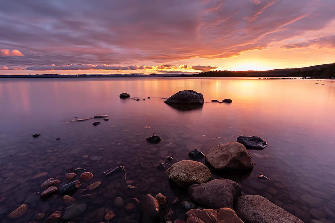 beautiful sunrise with purple and pink hues over Lake Superior