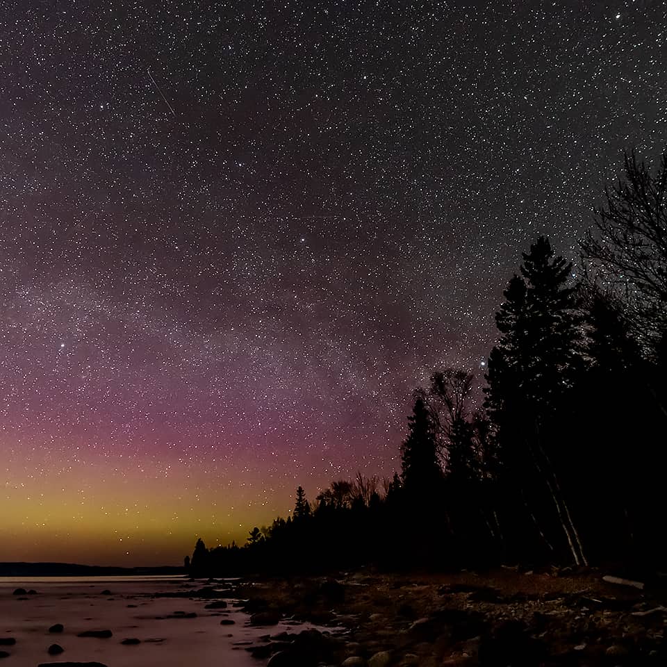 milky way above the aurora borealis on Lake Superior