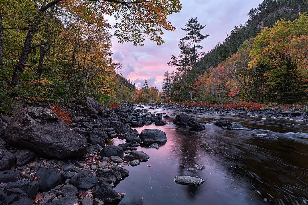 colourful sunset on a riverbank in autumn